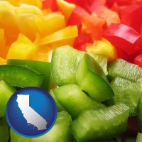 california map icon and sliced and diced green, red, and yellow peppers