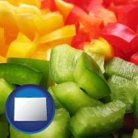 co map icon and sliced and diced green, red, and yellow peppers