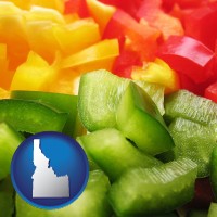 idaho map icon and sliced and diced green, red, and yellow peppers