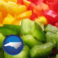 north-carolina map icon and sliced and diced green, red, and yellow peppers